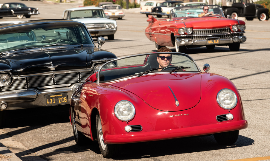 Carroll Shelby drove a Porsche in the film's early scenes of because the car was so reliable, compared to other vintage cars of the era. Producers had several old 356 Porsche's on set anyway, they say, so it made sense to put Shelby in one.